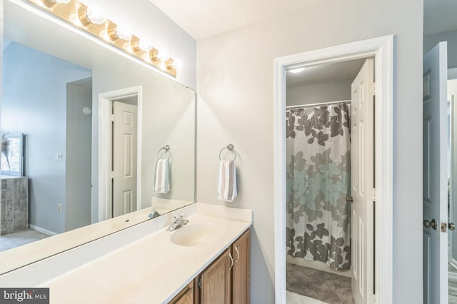 8822 Tanglewood Ln, Manassas, VA 20110 - full bath featuring vanity, baseboards, and curtained shower