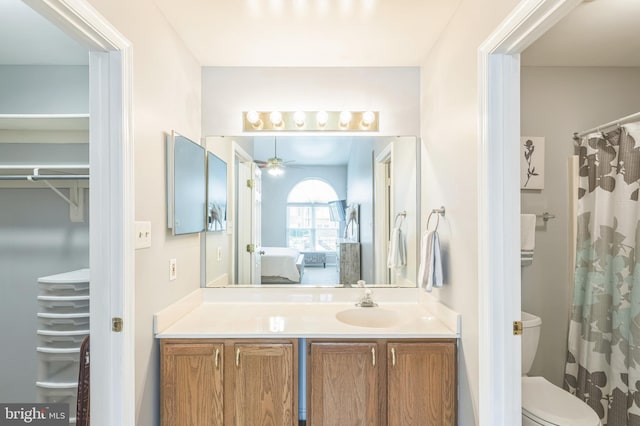 8822 Tanglewood Ln, Manassas, VA 20110 - ensuite bathroom featuring ceiling fan, toilet, and vanity
