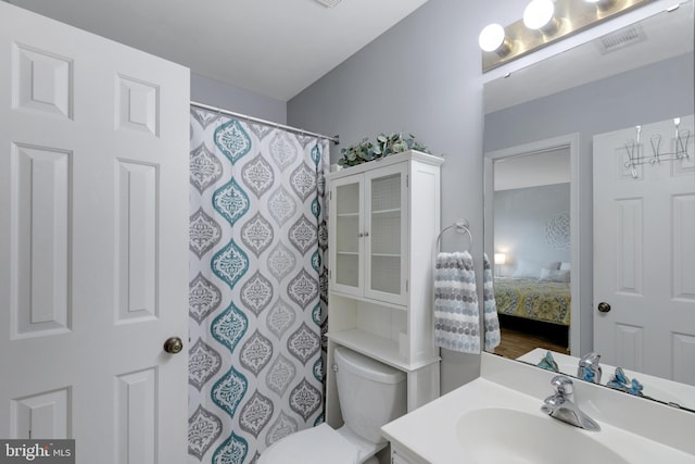 8822 Tanglewood Ln, Manassas, VA 20110 - bathroom featuring vanity, toilet, and a shower with shower curtain