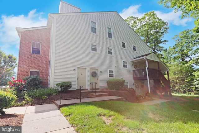8822 Tanglewood Ln, Manassas, VA 20110 - back of property featuring a yard, brick siding, and a chimney