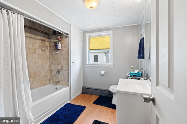 1409 S Clarion St, Philadelphia, PA 19147 - bathroom with a baseboard heating unit, wood finished floors, crown molding, shower / bath combo, and toilet