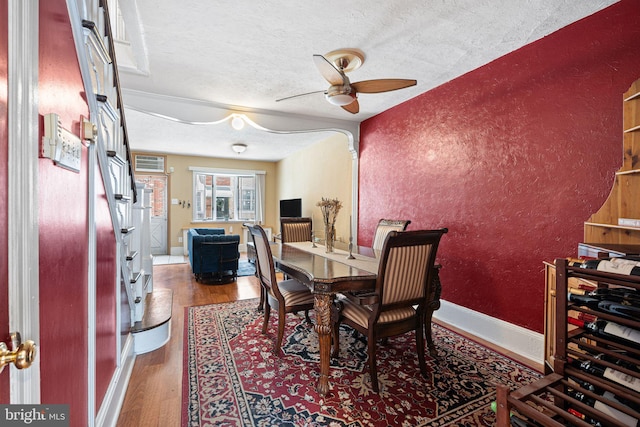 1409 S Clarion St, Philadelphia, PA 19147 - dining space featuring a ceiling fan, a textured ceiling, wood finished floors, a textured wall, and baseboards