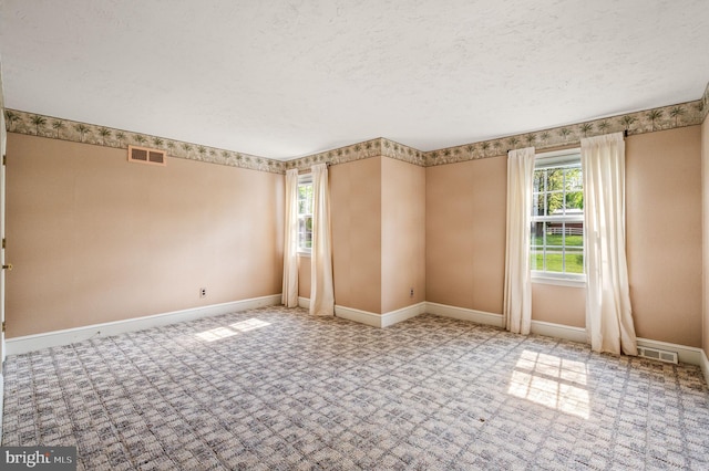 1050 Powderhorn Dr, Glen Mills, PA 19342 - carpeted spare room featuring baseboards and a textured ceiling
