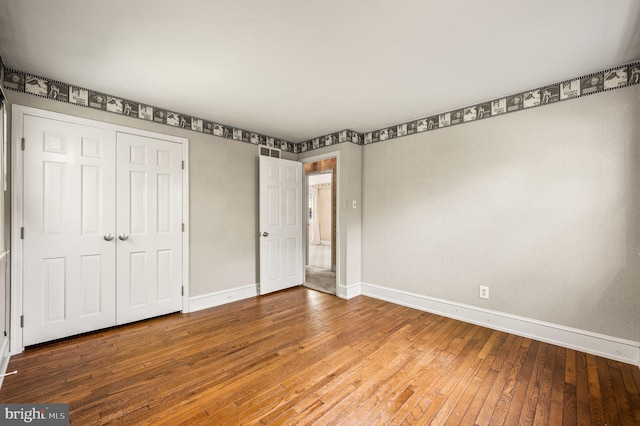1050 Powderhorn Dr, Glen Mills, PA 19342 - unfurnished bedroom featuring baseboards, wood-type flooring, and a closet