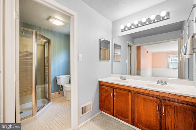 1050 Powderhorn Dr, Glen Mills, PA 19342 - bathroom with a shower stall, double vanity, toilet, and baseboards