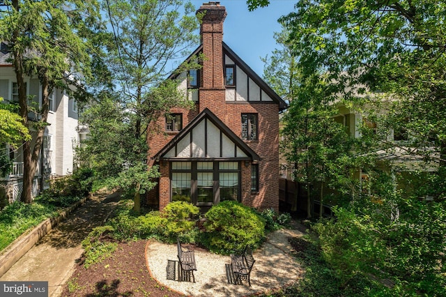 3419 Lowell St NW, Washington, DC 20016 - rear view of property featuring brick siding and a chimney