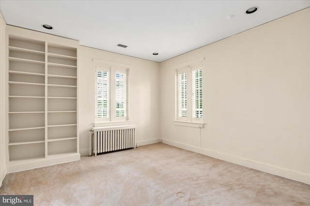 3419 Lowell St NW, Washington, DC 20016 - carpeted empty room featuring radiator and built in features