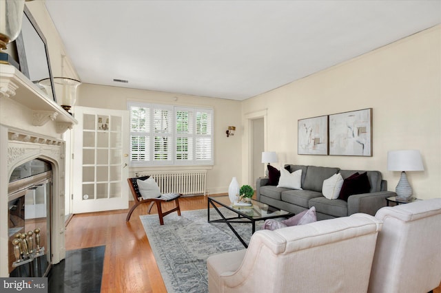 3419 Lowell St NW, Washington, DC 20016 - living area with radiator heating unit and wood finished floors