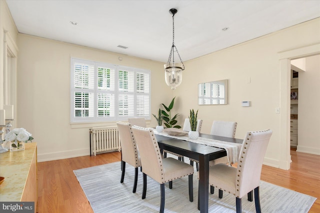 3419 Lowell St NW, Washington, DC 20016 - dining room featuring radiator and light wood-style flooring
