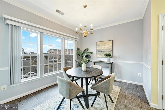 dining space with a chandelier, dark tile patterned flooring, crown molding, and baseboards