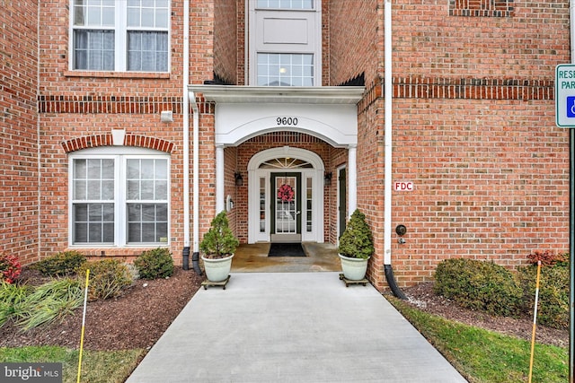 entrance to property with brick siding