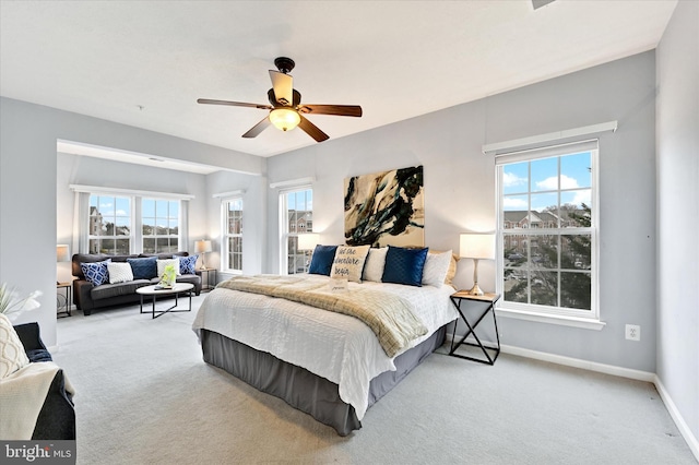 bedroom featuring carpet flooring, baseboards, and a ceiling fan