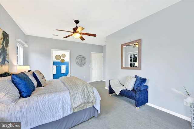 carpeted bedroom with baseboards, a ceiling fan, and a closet