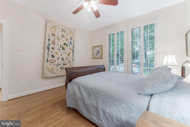 11709 Pine Tree Dr, Fairfax, VA 22033 - bedroom with baseboards, light wood-style flooring, and a ceiling fan