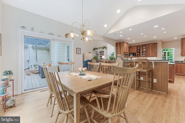 11709 Pine Tree Dr, Fairfax, VA 22033 - dining space with vaulted ceiling, light wood-style floors, recessed lighting, and arched walkways