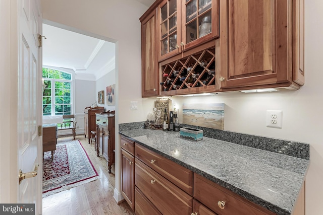 11709 Pine Tree Dr, Fairfax, VA 22033 - indoor dry bar with crown molding and light wood-style floors