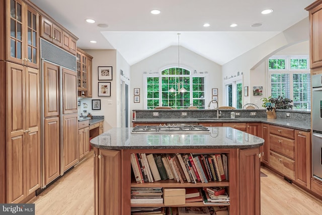 11709 Pine Tree Dr, Fairfax, VA 22033 - kitchen featuring open shelves, a sink, light wood-style floors, gas cooktop, and lofted ceiling