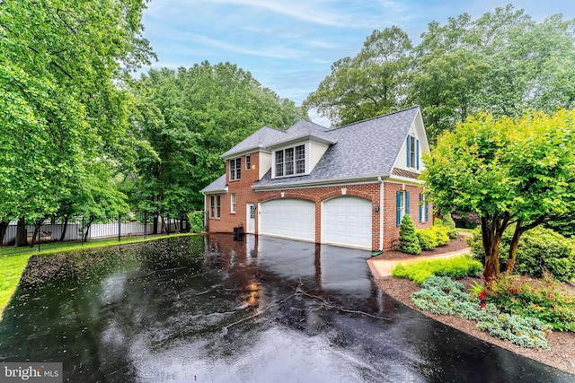 11709 Pine Tree Dr, Fairfax, VA 22033 - view of front of property with brick siding, roof with shingles, an attached garage, and driveway