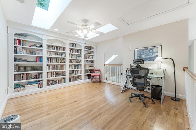 11709 Pine Tree Dr, Fairfax, VA 22033 - office space with attic access, baseboards, wood finished floors, a skylight, and recessed lighting