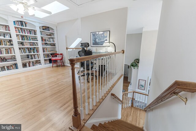 11709 Pine Tree Dr, Fairfax, VA 22033 - staircase featuring wood finished floors, ceiling fan, built in features, and baseboards