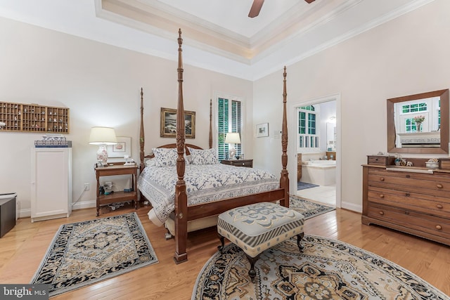 11709 Pine Tree Dr, Fairfax, VA 22033 - bedroom featuring crown molding, a tray ceiling, light wood finished floors, ensuite bath, and ceiling fan