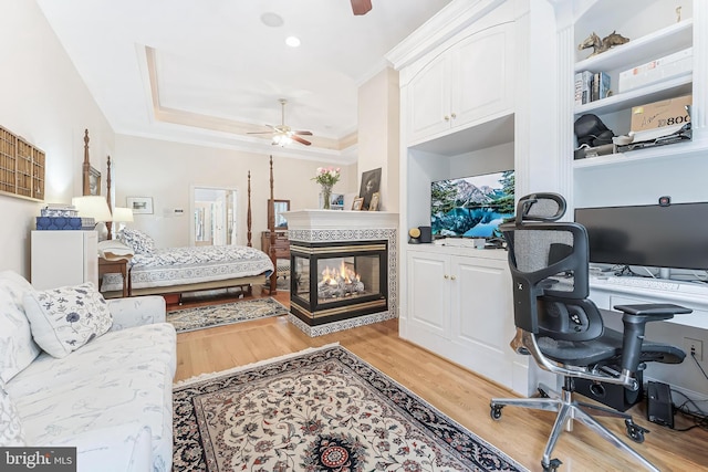 11709 Pine Tree Dr, Fairfax, VA 22033 - home office featuring ceiling fan, light wood-type flooring, ornamental molding, and a multi sided fireplace