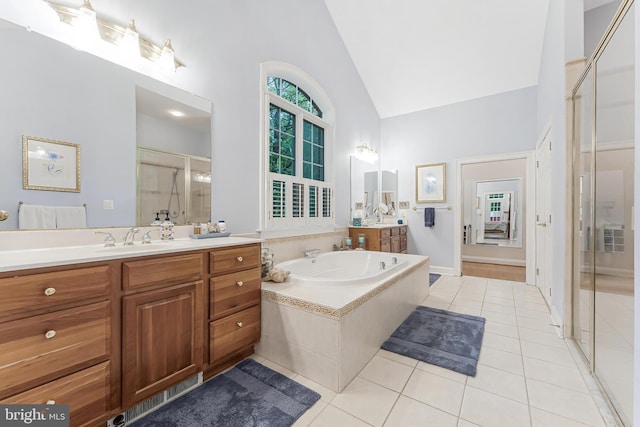 11709 Pine Tree Dr, Fairfax, VA 22033 - full bath with a stall shower, tile patterned flooring, two vanities, high vaulted ceiling, and a bath