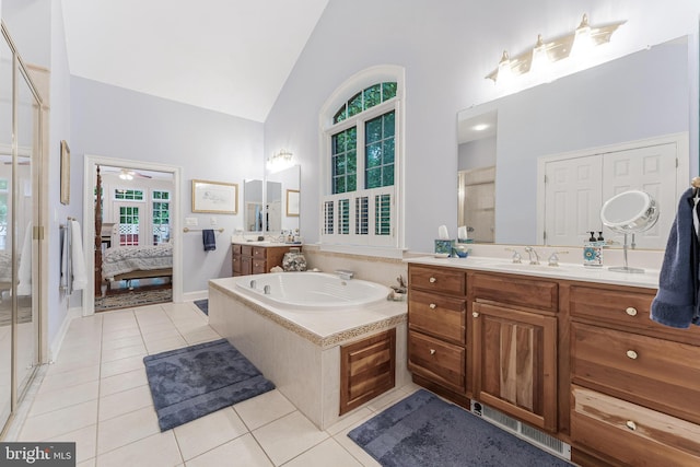 11709 Pine Tree Dr, Fairfax, VA 22033 - ensuite bathroom with high vaulted ceiling, tile patterned flooring, two vanities, a stall shower, and a garden tub