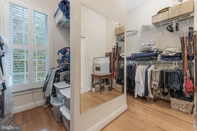 11709 Pine Tree Dr, Fairfax, VA 22033 - walk in closet with wood finished floors