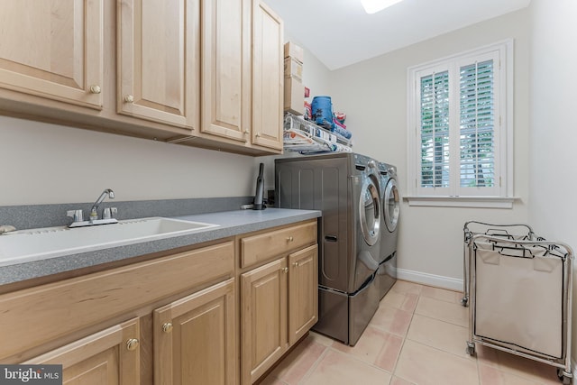 11709 Pine Tree Dr, Fairfax, VA 22033 - laundry room featuring cabinet space, separate washer and dryer, light tile patterned flooring, and baseboards