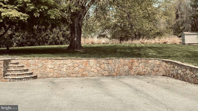 33 Morgan Hollow Way, Landenberg, PA 19350 - view of patio with a storage shed and an outbuilding
