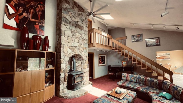 33 Morgan Hollow Way, Landenberg, PA 19350 - living room with a wood stove, ceiling fan, carpet floors, vaulted ceiling, and stairway