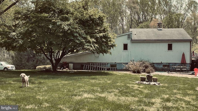 33 Morgan Hollow Way, Landenberg, PA 19350 - back of property featuring a lawn, roof with shingles, and a chimney