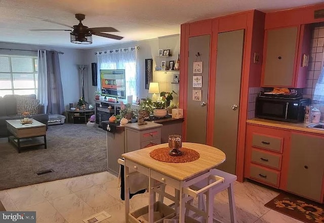 79 Martin Dr, Whiting, NJ 08759 - dining area featuring light marble finish floors, healthy amount of natural light, and a ceiling fan