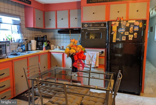 79 Martin Dr, Whiting, NJ 08759 - kitchen with black appliances, decorative backsplash, light marble finish floors, and light countertops