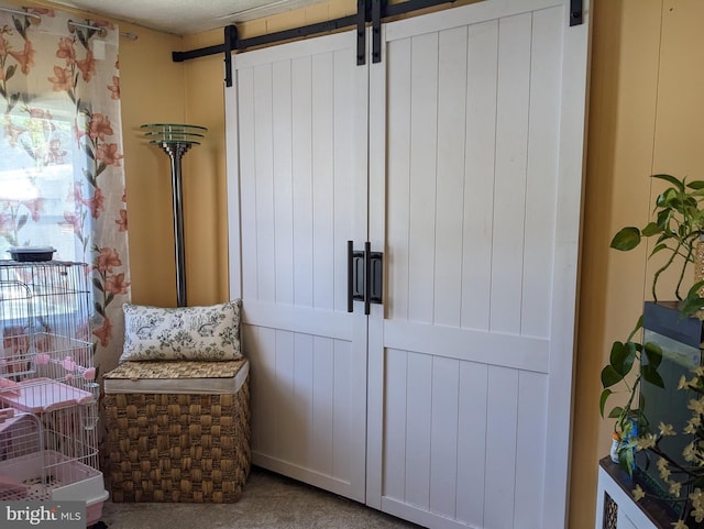 79 Martin Dr, Whiting, NJ 08759 - sitting room featuring a barn door and carpet flooring