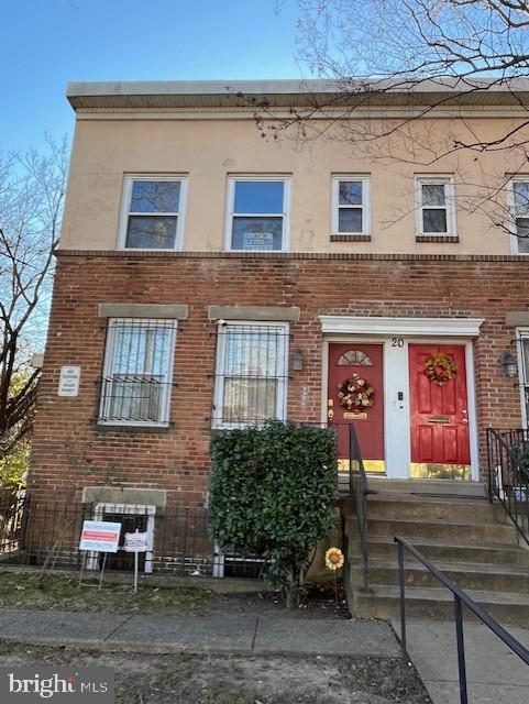 20 Galveston Pl SW Unit B, Washington, DC 20032 - view of front of property featuring brick siding and stucco siding