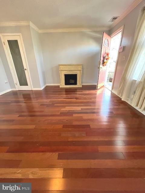 20 Galveston Pl SW Unit B, Washington, DC 20032 - unfurnished living room featuring wood finished floors, ornamental molding, baseboards, and a fireplace