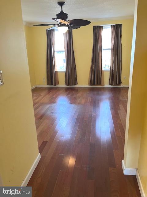 20 Galveston Pl SW Unit B, Washington, DC 20032 - empty room featuring ceiling fan, hardwood / wood-style floors, crown molding, and baseboards