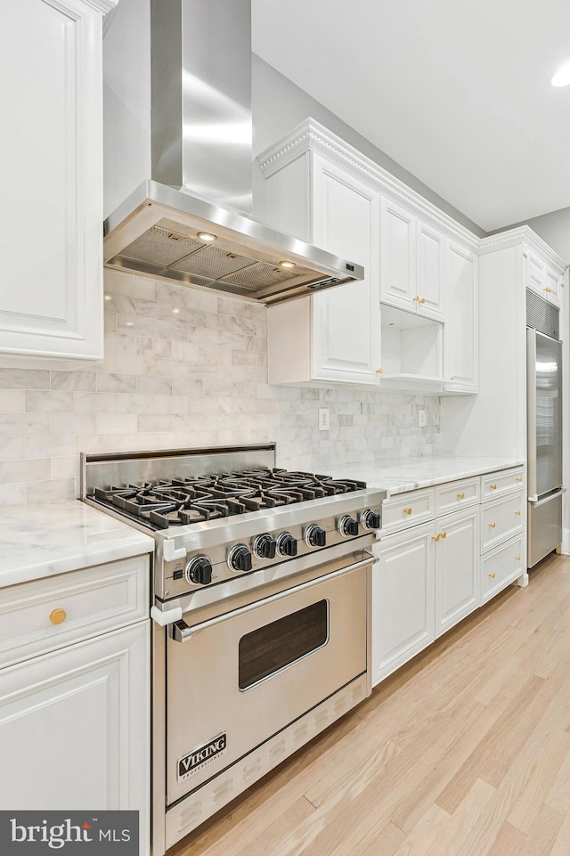 1473 Evans Farm Dr, Mclean, VA 22101 - kitchen with wall chimney exhaust hood, high quality appliances, white cabinetry, and tasteful backsplash