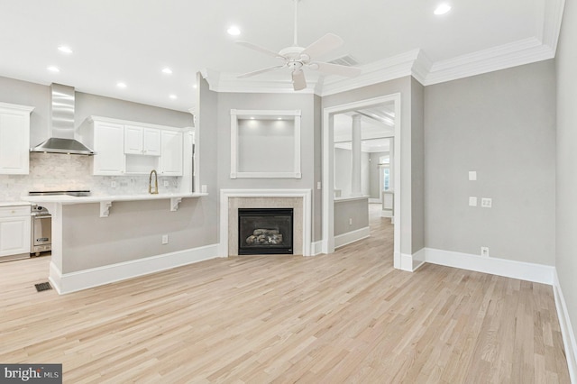 1473 Evans Farm Dr, Mclean, VA 22101 - unfurnished living room with ceiling fan, ornamental molding, light wood-style flooring, baseboards, and recessed lighting
