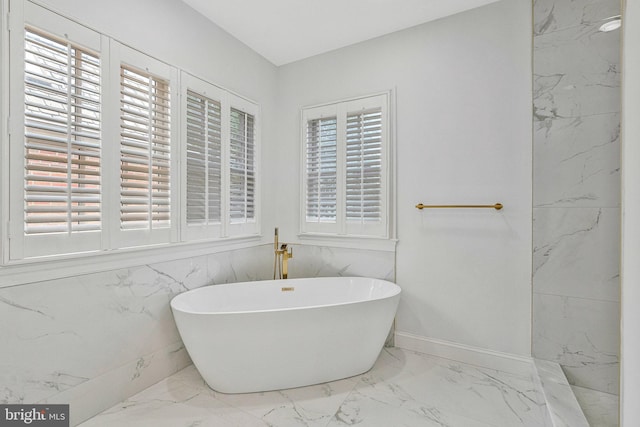 1473 Evans Farm Dr, Mclean, VA 22101 - bathroom featuring marble tiled floors, a soaking tub, and baseboards