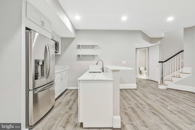 1473 Evans Farm Dr, Mclean, VA 22101 - kitchen with stainless steel fridge, open shelves, a sink, light countertops, and light wood-type flooring