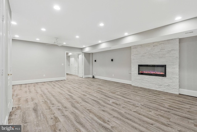 1473 Evans Farm Dr, Mclean, VA 22101 - unfurnished living room with wood finished floors, a stone fireplace, recessed lighting, baseboards, and ceiling fan