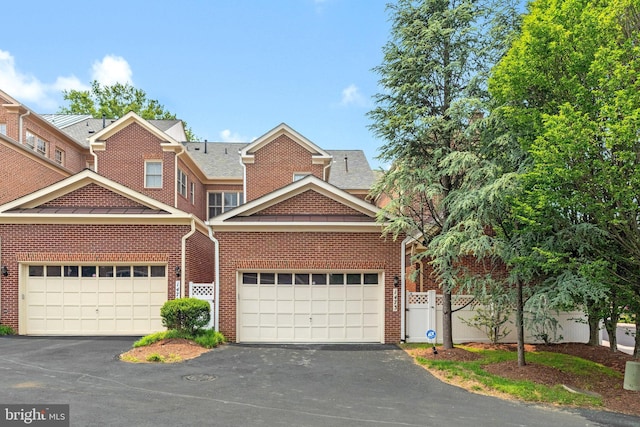 1473 Evans Farm Dr, Mclean, VA 22101 - view of front of home featuring brick siding, driveway, a garage, and a shingled roof