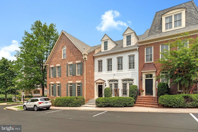1473 Evans Farm Dr, Mclean, VA 22101 - view of property featuring brick siding and uncovered parking