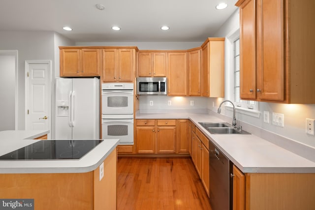 30 Amandas Teal Dr, Bridgeville, DE 19933 - kitchen featuring stainless steel appliances, a sink, light wood-type flooring, recessed lighting, and light countertops