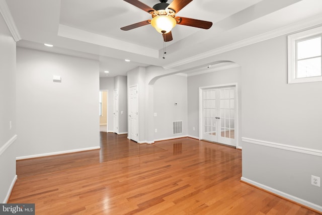 30 Amandas Teal Dr, Bridgeville, DE 19933 - unfurnished room featuring arched walkways, a tray ceiling, recessed lighting, a ceiling fan, and light wood-type flooring