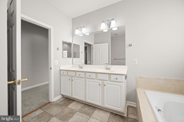 30 Amandas Teal Dr, Bridgeville, DE 19933 - bathroom featuring double vanity, baseboards, and a bath