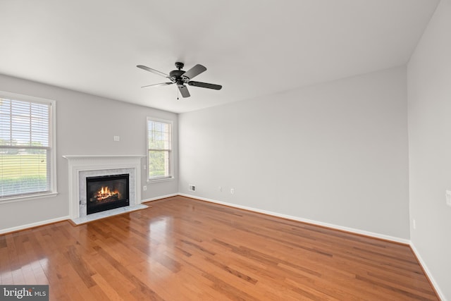 30 Amandas Teal Dr, Bridgeville, DE 19933 - unfurnished living room featuring wood finished floors, healthy amount of natural light, baseboards, and a ceiling fan